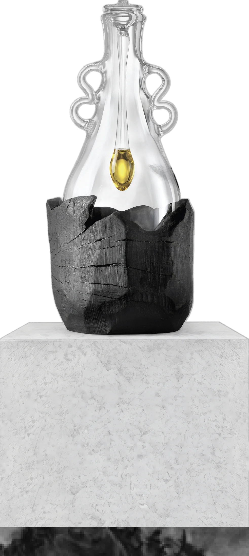 Hand-blown glass vessel holding a seed-shaped vial of olive oil, set in burnt olive wood on a stone plinth